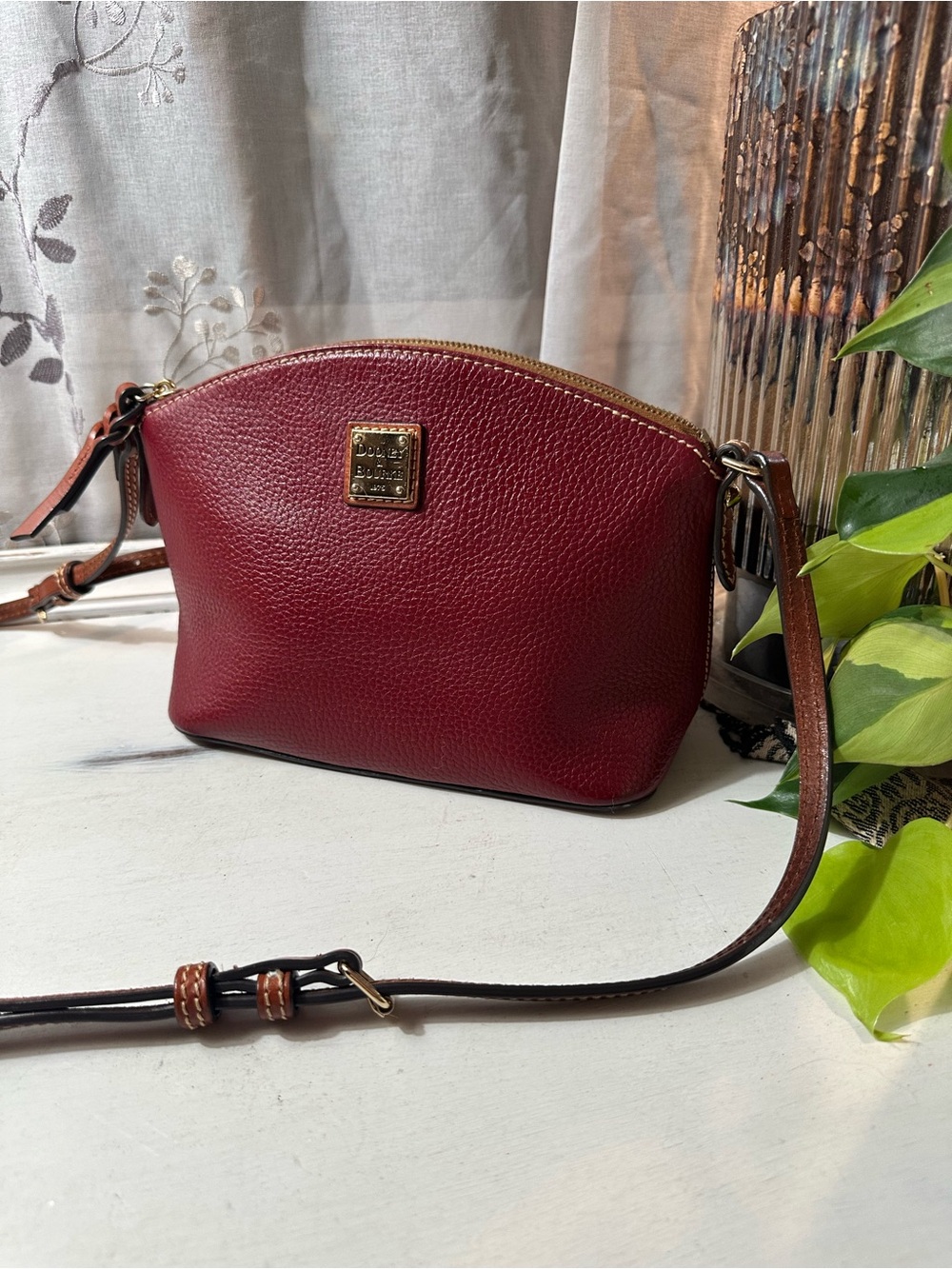Dooney & Bourke Pebble Grain Leather Domed Crossbody Bag in Burgundy